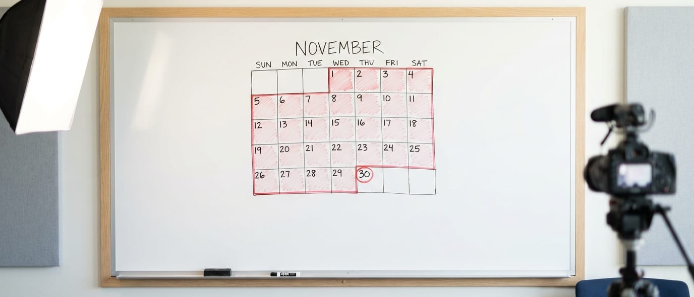 An office whiteboard with a hand-drawn calendar and a thirty-day lock window boxed in red marker